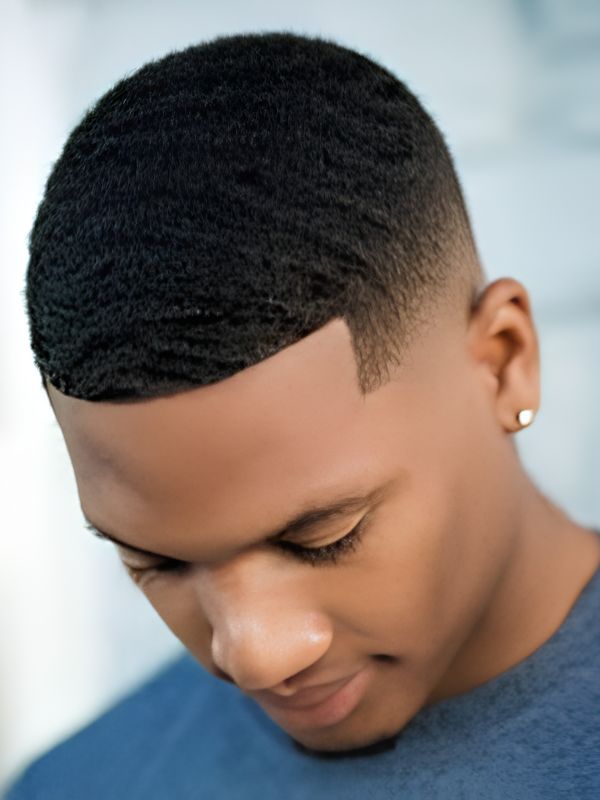 Low Taper Fade Black Haircut with Design