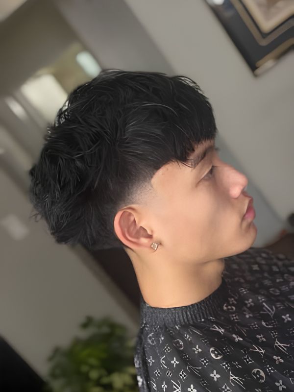 Mid taper fade with textured fringe asian
