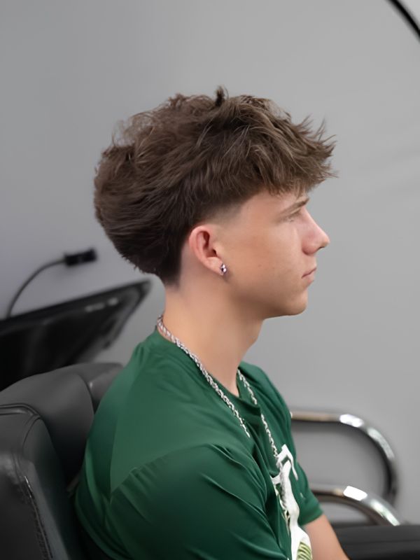 Mid taper fade with textured fringe straight hair